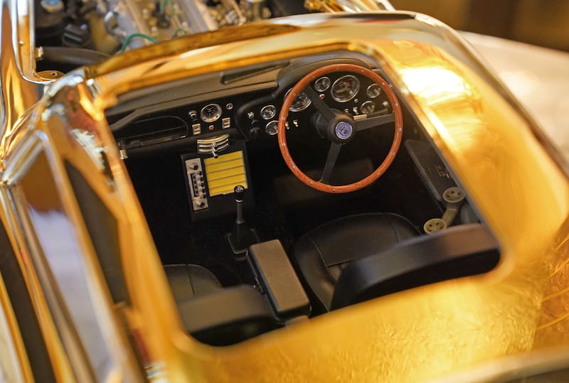 The interior of a 24-carat gold-plated model of James Bond’s Goldfinger Aston Martin DB5