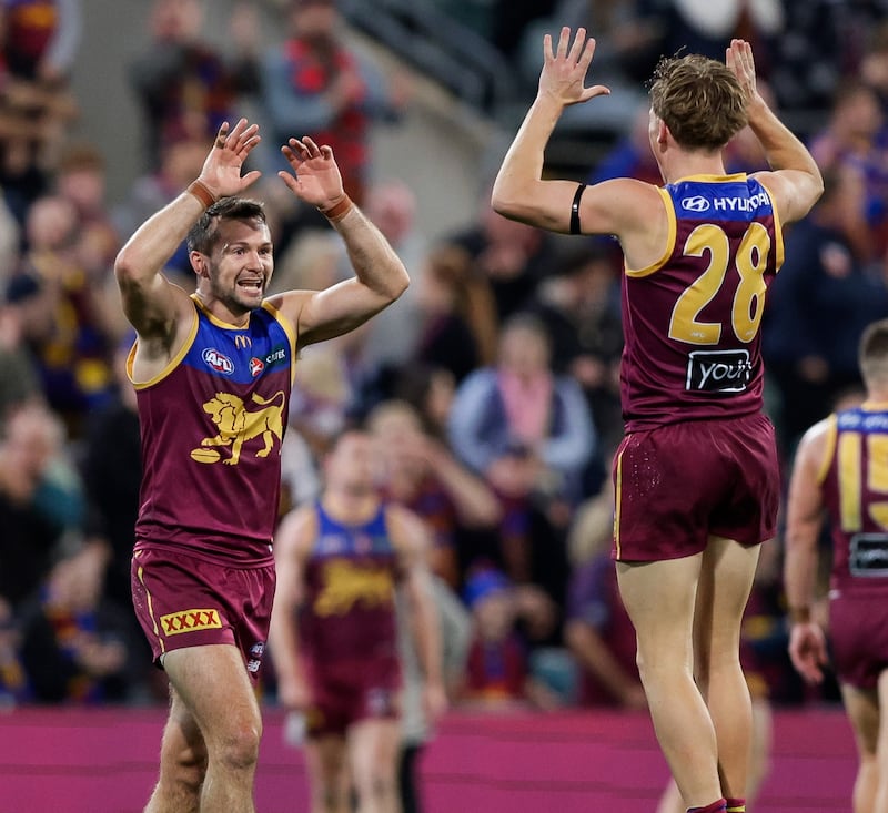 Conor McKenna and Jaspa Fletcher of the Lions celebrate following the 2024 AFL Round 16 match between the Brisbane Lions and the Melbourne Demons at The Gabba on June 28, 2024 in Brisbane, Australia. (Photo by Russell Freeman/AFL Photos via Getty Images)