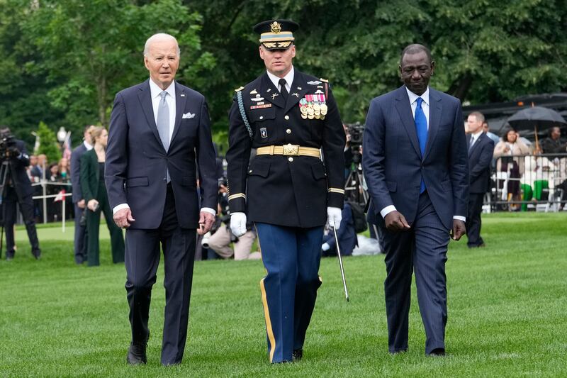 US President Joe Biden and Kenya’s President William Ruto review the troops with Colonel David Rowland, commander of the 3rd US Infantry Regiment, The Old Guard, at the White House (Jacquelyn Martin/AP)