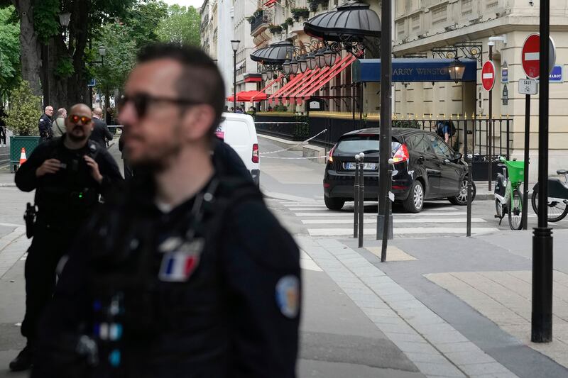 Police officers at the scene of the robbery in Paris (Thibault Camus/AP)