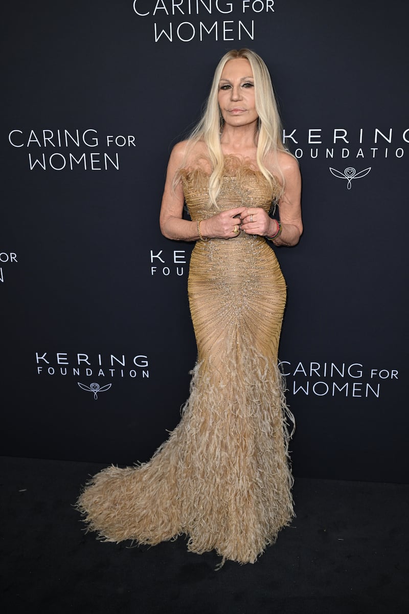 Donatella Versace wowed in an opulent golden gown