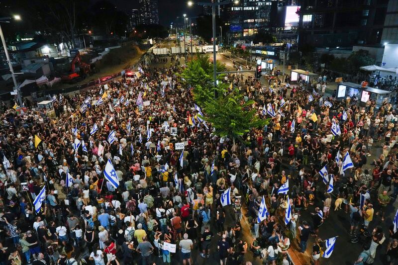 People attend a rally demanding a ceasefire deal and the immediate release of hostages held by Hamas on Wednesday in Tel Aviv (Ariel Schalit/AP)