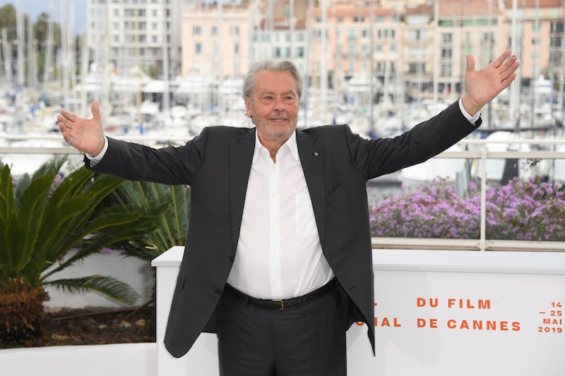 Alain Delon posing for photographers at the Cannes Film Festival in 2019 (Arthur Mola/Invision/AP)