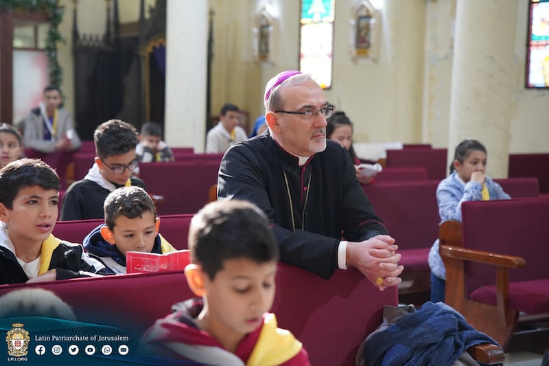 Cardinal Pierbattista Pizzaballa, leader of the Catholic Church in the Holy Land, prays with Catholic children during a visit to Gaza City in May 2024, the only time the cardinal has been allowed to visit Gaza since the war began on October 7 2023 PICTURE: ACN