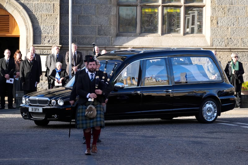 The funeral cortege was led by Fergus Mutch on bagpipes