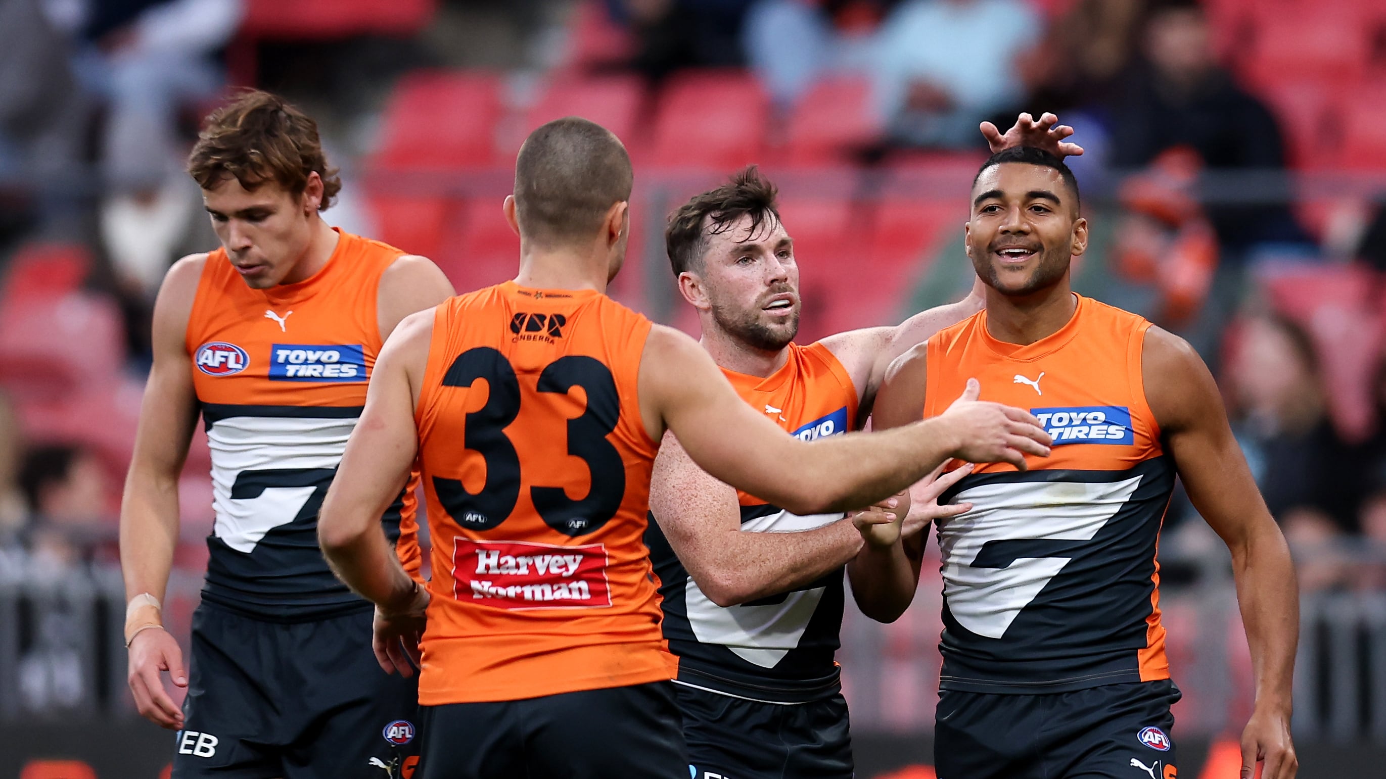 SYDNEY, AUSTRALIA - JUNE 16: Callum M. Brown of the Giants celebrates kicking a goal with team mates during the round 14 AFL match between Greater Western Sydney Giants and Port Adelaide Power at ENGIE Stadium, on June 16, 2024, in Sydney, Australia. (Photo by Brendon Thorne/AFL Photos/via Getty Images)
