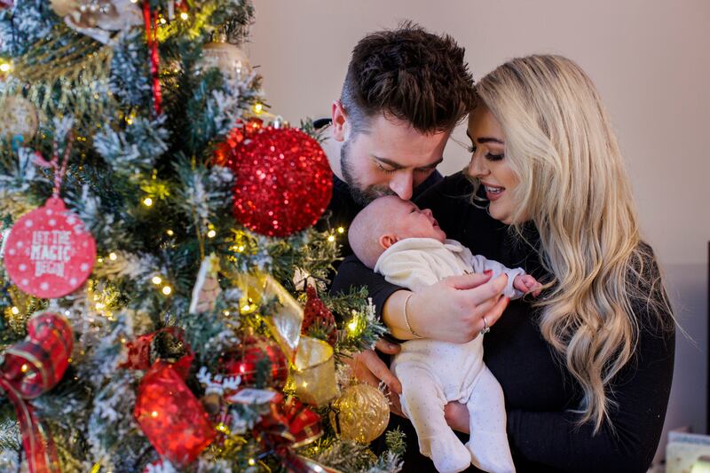 Marcus and Rachel Gilmore with the daughter Raina at their home outside Ballyclare. Picture date: Thursday December 21, 2023. PA Photo. See PA story ULSTER Baby. Photo credit should read: Liam McBurney/PA Wire