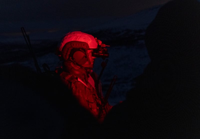 Guy Martin under red light in the night amongst the grainy snow of Norway