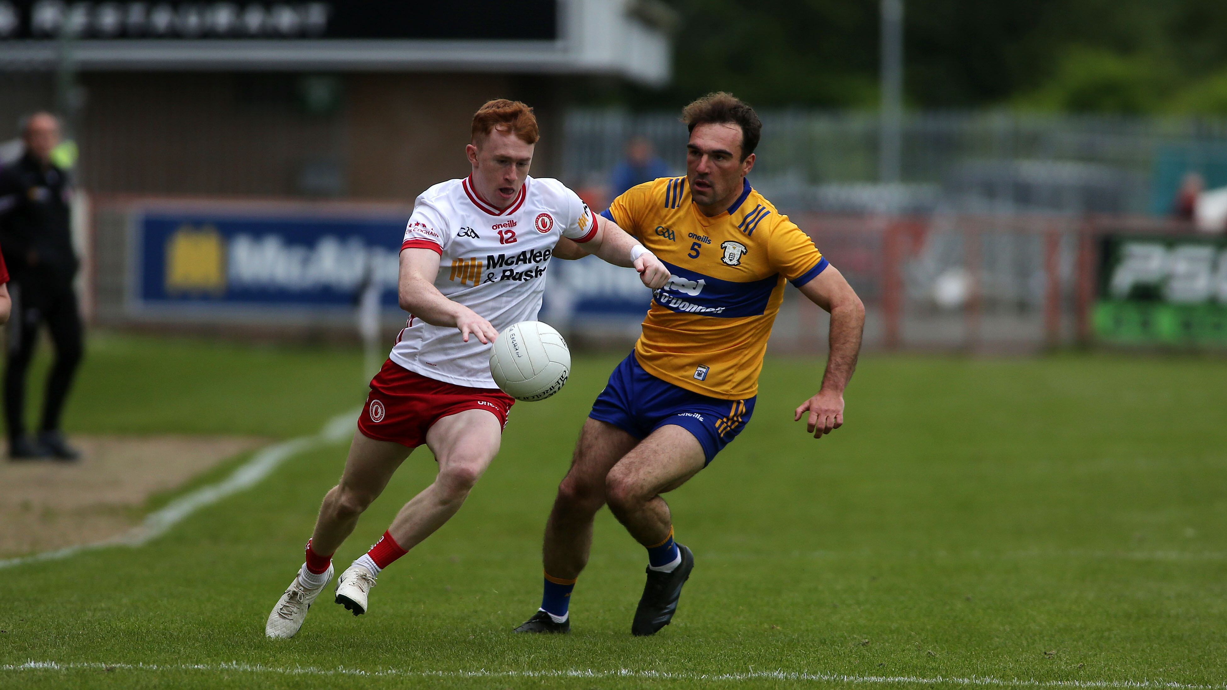 Clare defender Alan Sweeney tackles as Seanie O'Donnell goes on the attack for Tyrone. Picture: Seamus Loughran