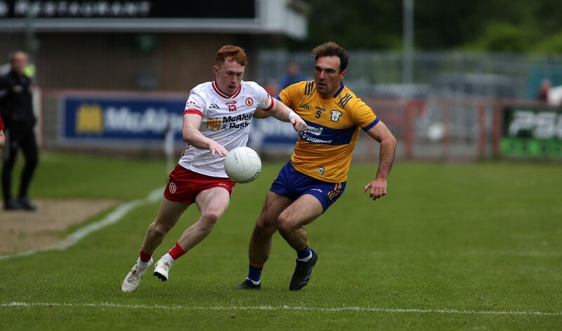 Clare defender Alan Sweeney tackles as Seanie O'Donnell goes on the attack for Tyrone. Picture: Seamus Loughran