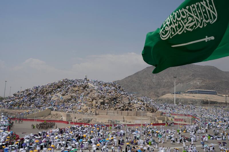 Muslim pilgrims gather at top of the rocky hill known as the Mountain of Mercy, on the Plain of Arafat, during the annual Hajj pilgrimage (Rafiq Maqbool/AP)