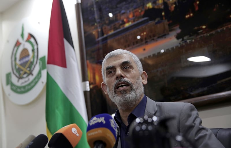 Yahya Sinwar speaks to foreign correspondents in his office in Gaza City on May 10 2018 (Khalil Hamra/AP)