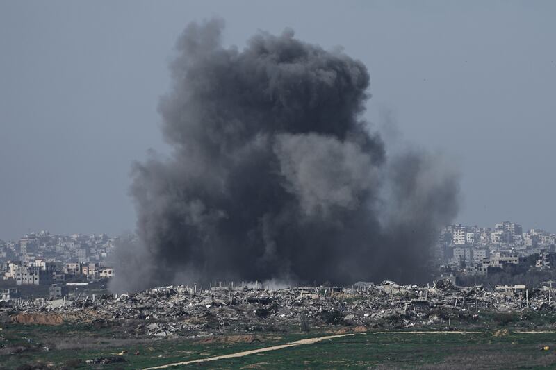 Smoke rises following an Israeli bombardment in Gaza on Sunday (Tsafrir Abayov/AP)