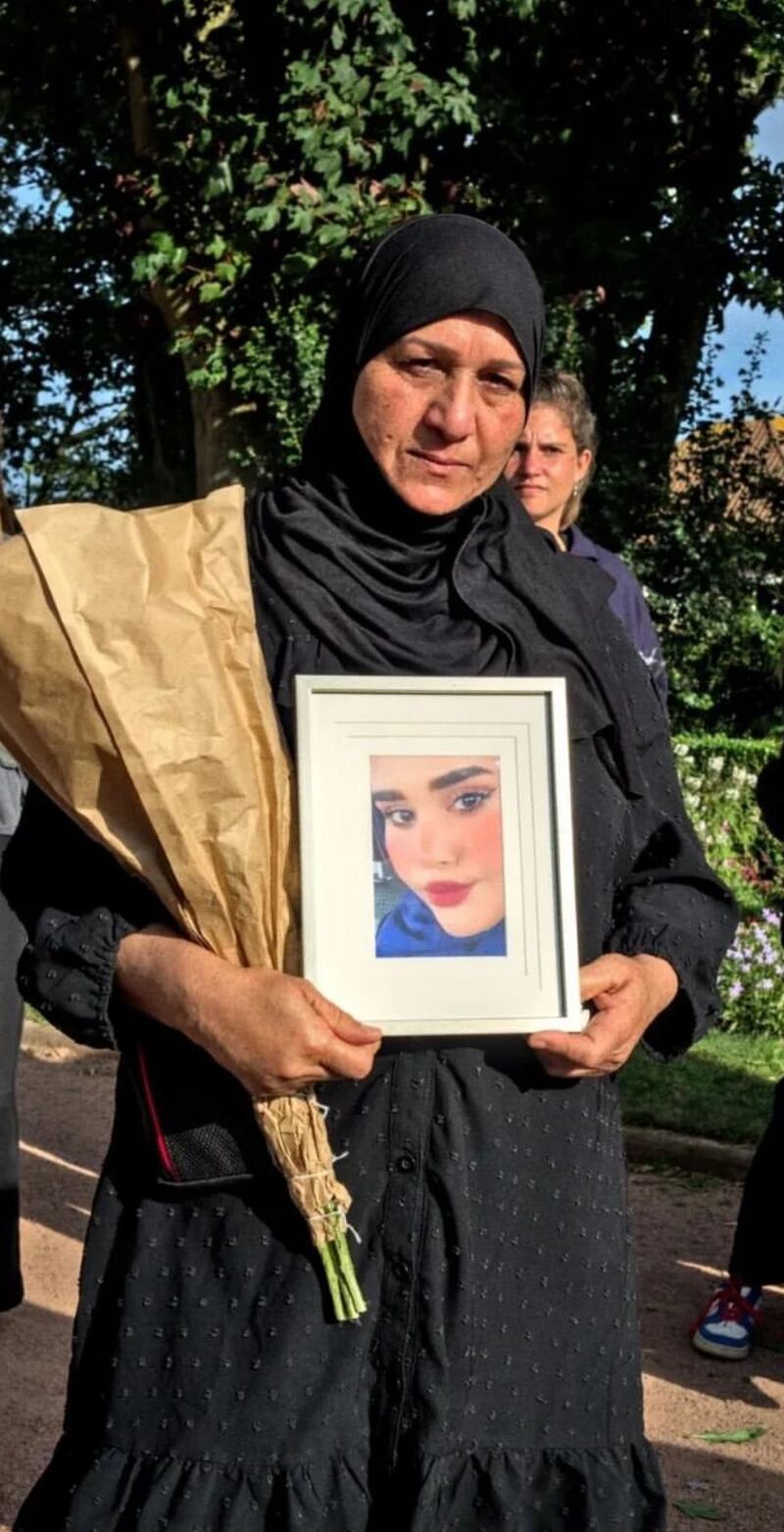 Amira Al Shammari holds a picture of her daughter who she described as someone who enjoyed beautiful things in life.