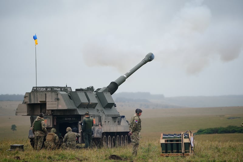 Ukrainian troops firing a British donated AS90 155mm self-propelled artillery guns.