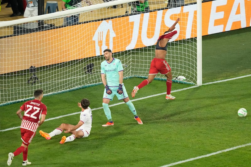 Ayoub El Kaabi, right, celebrates his winner (Petros Karadjias/AP)