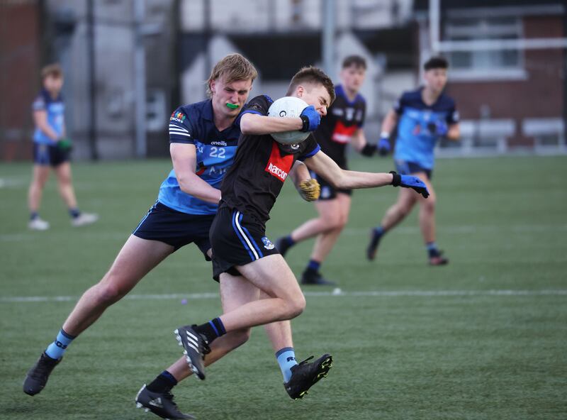 St. Patrick's  Mark Guerin and Rathmore’s Sean McCarthy during the MacLarnon Cup Semi Final game at Coláiste Feirste in Belfast.
PICTURE: COLM LENAGHAN
