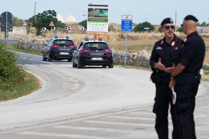 Italian paramilitary police officers patrol near Borgo Egnazia, venue of the G7 summit in southern Italy (Gregorio Borgia/AP)