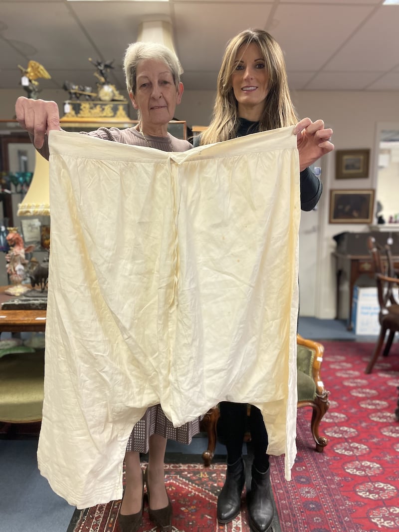 Hansons Auctioneers employees Gillian Finney (left) and Helen Smith hold up the bloomers