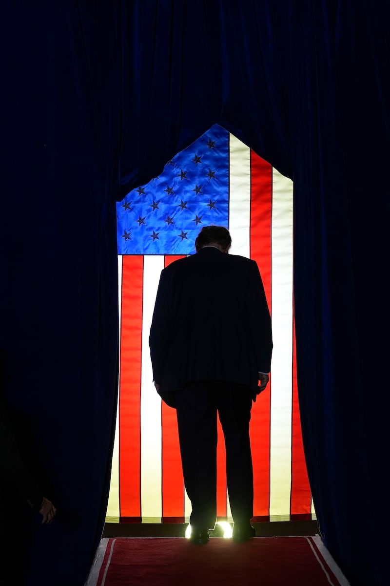 Mr Trump walking off stage after speaking at a campaign event in Manchester, New Hampshire, on Saturday (Matt Rourke/AP)