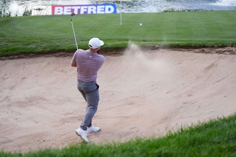 Tyrrell Hatton hits what he described as an “unreal” bunker shot on the 18th hole in the Betfred British Masters