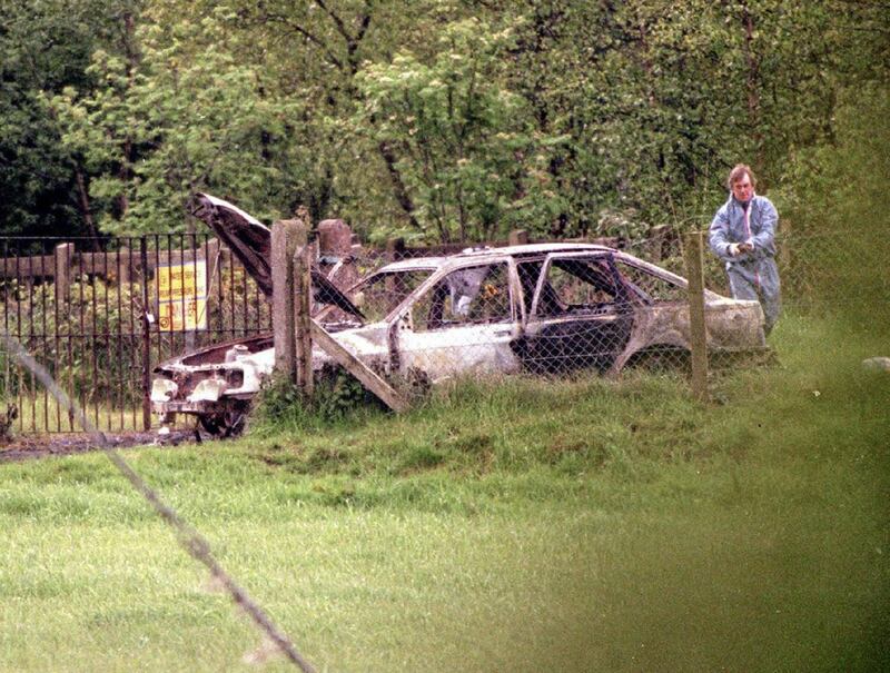 A burnt out car at the scene where Sean Brown's body was found in 1997