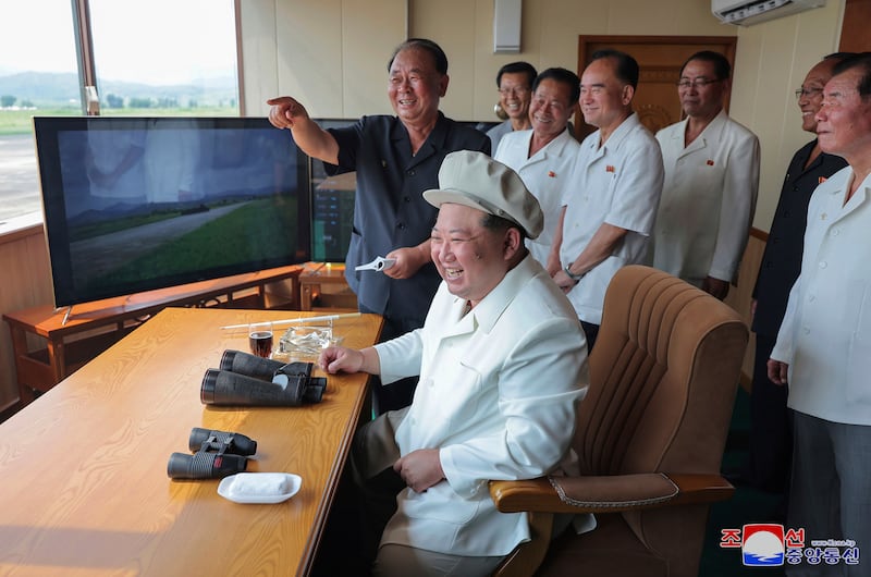 North Korean leader Kim Jong Un inspects a demonstration of an exploding drone crashing into a target at an undisclosed location (Korean Central News Agency/Korea News Service/AP)