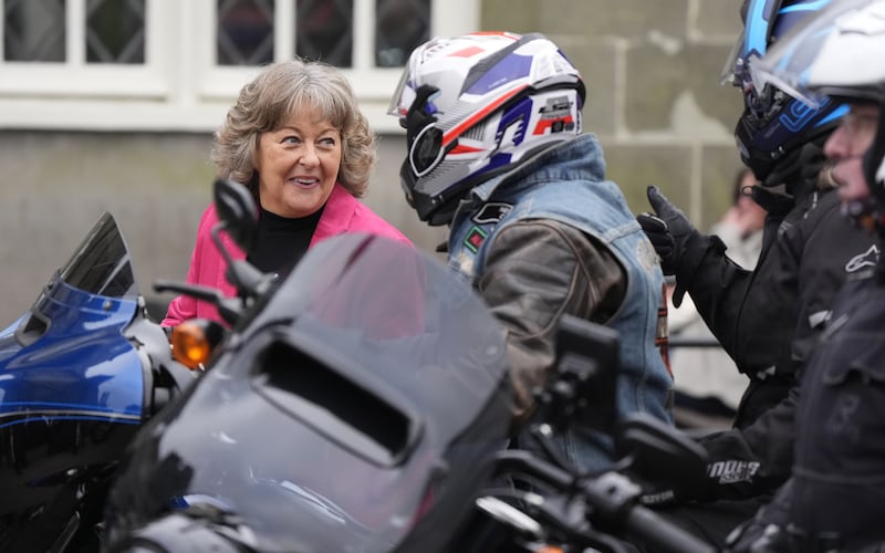 Tiggy Walker (left) chats with Harley Davidson riders who are escorting her husbands hearse in tribute