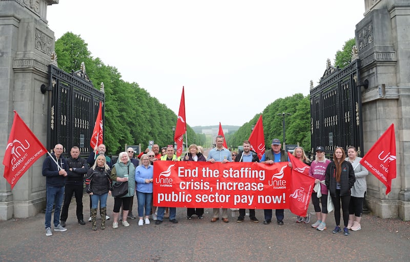 NIPSA Members protest at Stormont on Monday.
Members employed by the Education Authority (non-teaching staff) had an expectation that the long overdue Pay and Grading Review, agreed with employers in 2019, would be addressed within the current Assembly budget.

The deal, which would start to address levels of poverty pay that are endemic to the education sector, was supposed to be included in the new financial package (which formed a key part of the restoration of the N.I. Assembly). Education workers are among the lowest paid in society, with many working multiple jobs to make ends meet and the failure to implement the Pay and Grading review has pushed members further into poverty.

Following meetings with the Education Minister, Paul Givan, and clarification that funding for the review is not available within the budget agreed by Stormont, NIPSA has been left with no option other than to take action to support its members.
As a result, NIPSA, and the other Education trade union members, will take part in co-ordinated industrial action, beginning with school bus drivers who will strike on 20, 21, 22 May and 3, 4 June.

PICTURE COLM LENAGHAN