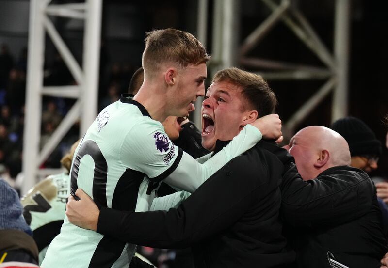 Chelsea’s Cole Palmer, who set up his team’s late double, celebrates with a fan