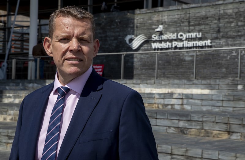 Leader of Plaid Cymru Rhun ap Iorwerth stands outside the Senedd