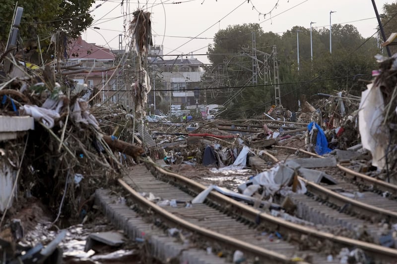 Train tracks are seen affected by floods in Paiporta, near Valencia (Alberto Saiz/AP)