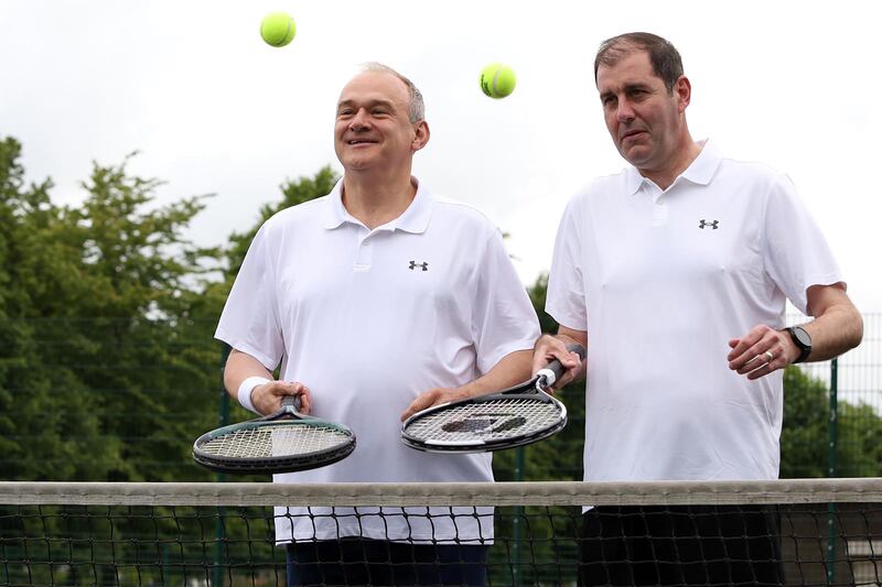 Lee Dillon, the Liberal Democrat MP for Newbury, pictured playing tennis in his constituency with his party’s leader Sir Ed Davey