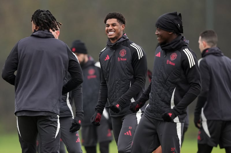 Marcus Rashford, centre, was seen training with his Manchester United team-mates on Wednesday but has not played since December 12