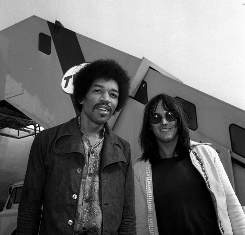 Guitarist Jimi Hendrix with his road manager Eric Barrett at Heathrow Airport