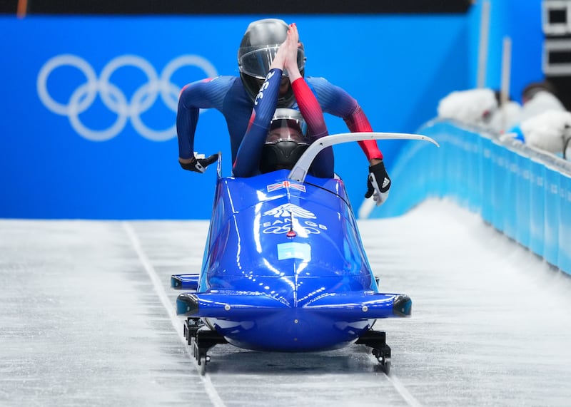 Montell Douglas (back) competing with pilot Mica McNeil at the 2022 Winter Olympics