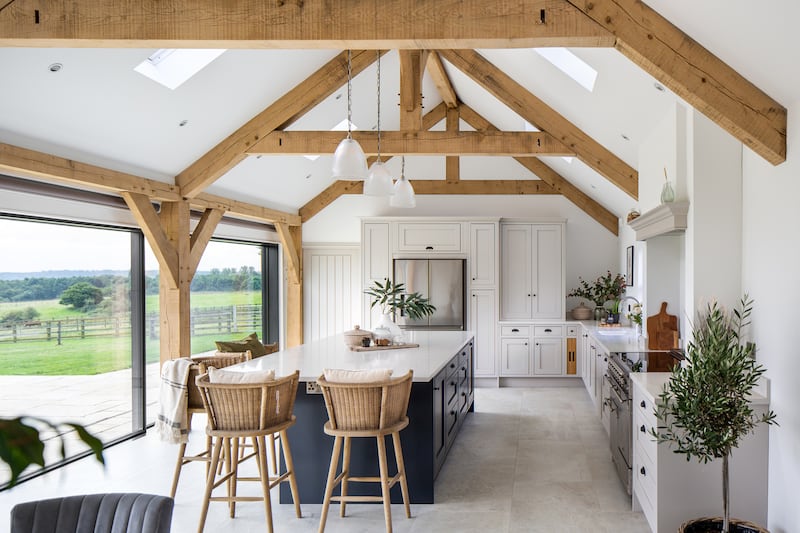 Oak-framed modern self-built home in the heart of the country. A bespoke fitted kitchen which has created the main living space in the house. A softwood vaulted timber frame takes centre stage with the addition of bi-fold doors that open onto a terrace, meaning the space is flooded with natural light