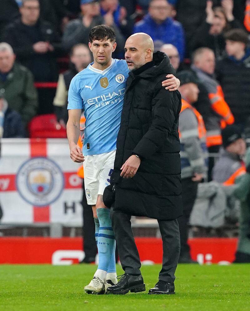 Guardiola (right) has been unable to rely on Stones this season