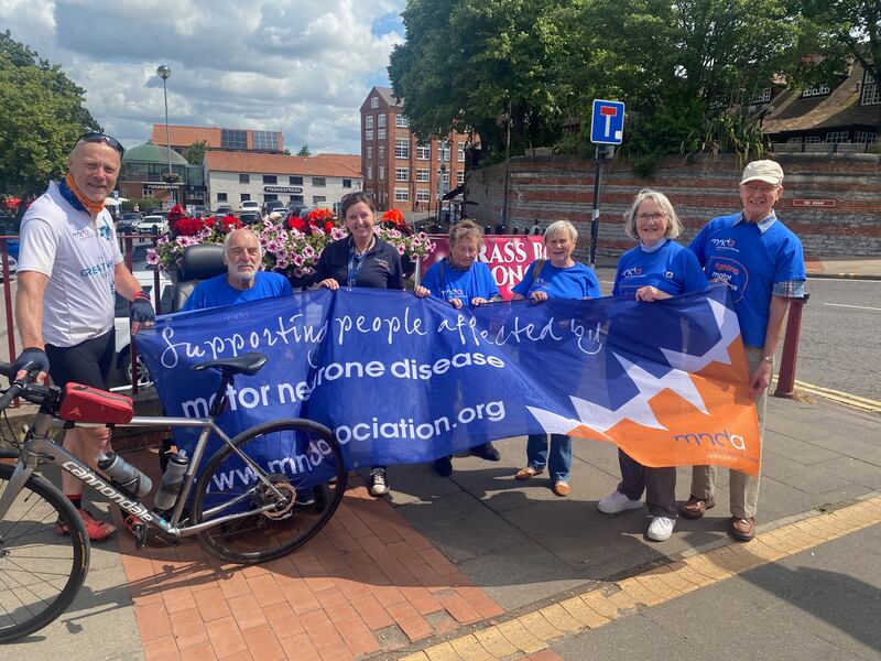 Pete Hawkins standing with the Nottinghamshire branch of the MND Association in Newark