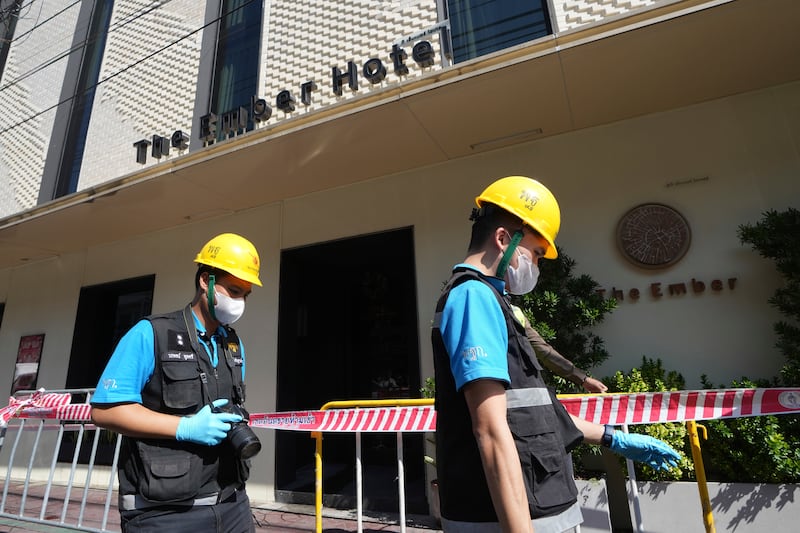 A police forensics team working at the hotel in Bangkok (Sakchai Lalit/AP)