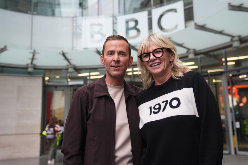 Radio 2 presenters Zoe Ball and Scott Mills leave the BBC in central London after she announced she is stepping down from the breakfast show and handing over the reins to him