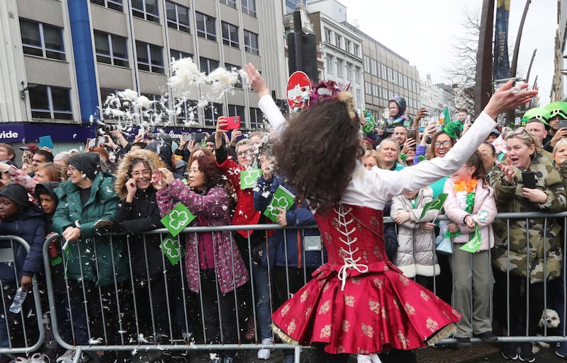 Performers entertain the crowd as  Thousands line the streets for the St Patrick’s day Parade in Belfast on Sunday.
PICTURE COLM LENAGHAN