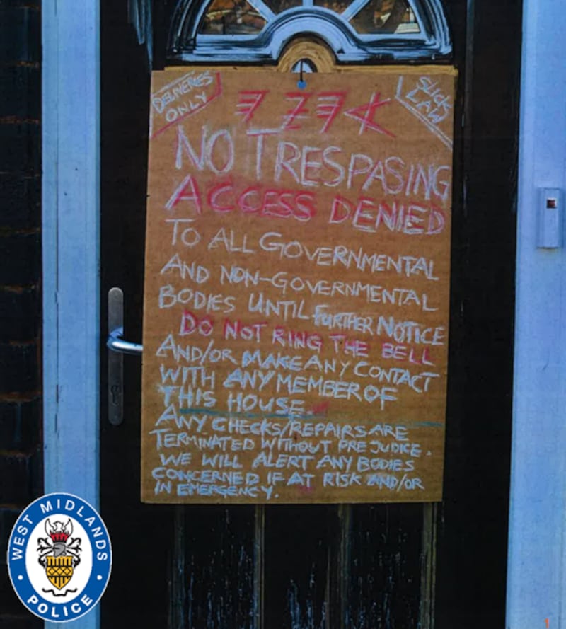 A sign placed on the door of the Clarence Road home