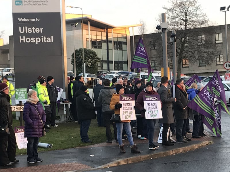 Health workers standing outside Ulster Hospital in Belfast, where they are staging another day of strike action. Picture by Rebecca Black/PA Wire&nbsp;