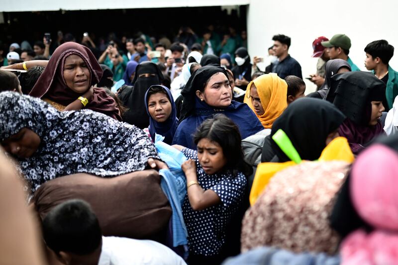 Rohingya refugees were relocated from their temporary shelter in the basement of a community hall following a protest rejecting them in Banda Aceh (Reza Saifullah/AP).