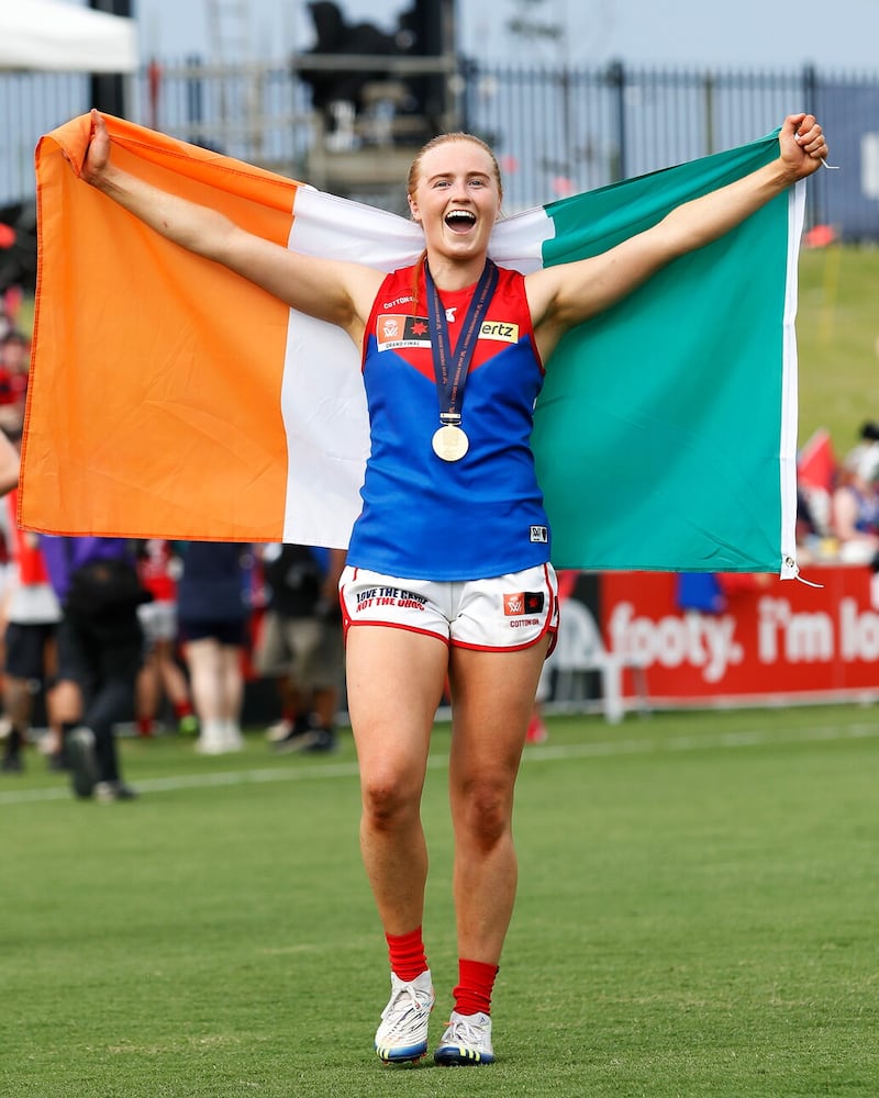 Blaithin Mackin proudly carries the Irish flag after last season's Grand Final success. Picture: AFL Photos