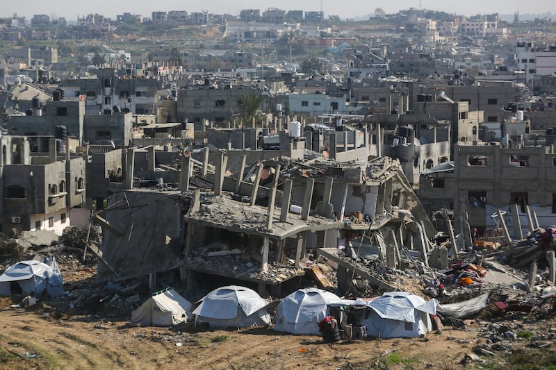 Tents are set up next to houses destroyed by Israeli bombardment in Beit Lahia, northern Gaza, after Israel began allowing hundreds of thousands of Palestinians to return to the heavily damaged area (Jehad Alshrafi/AP)