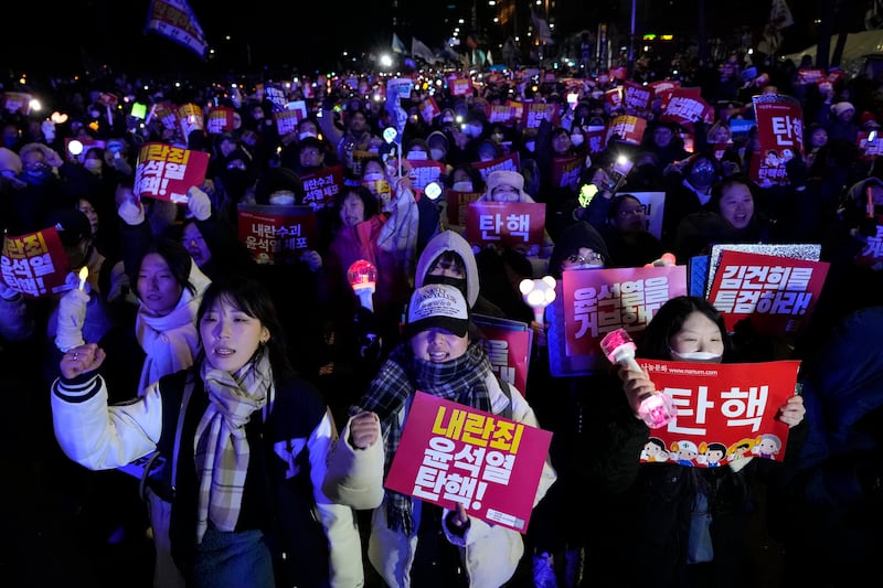 Protesters stage a rally demanding Yoon Suk Yeol’s impeachment (Ahn Young-joon/AP)