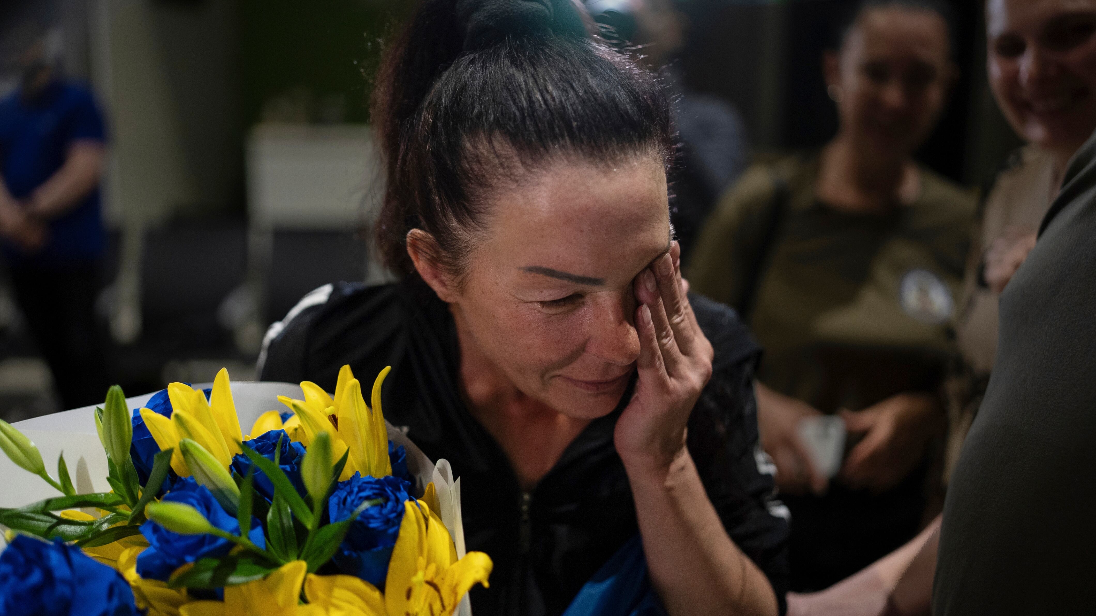 Olena Pekh cries while she speaks to her daughter via a video call in Kyiv (Alex Babenko)