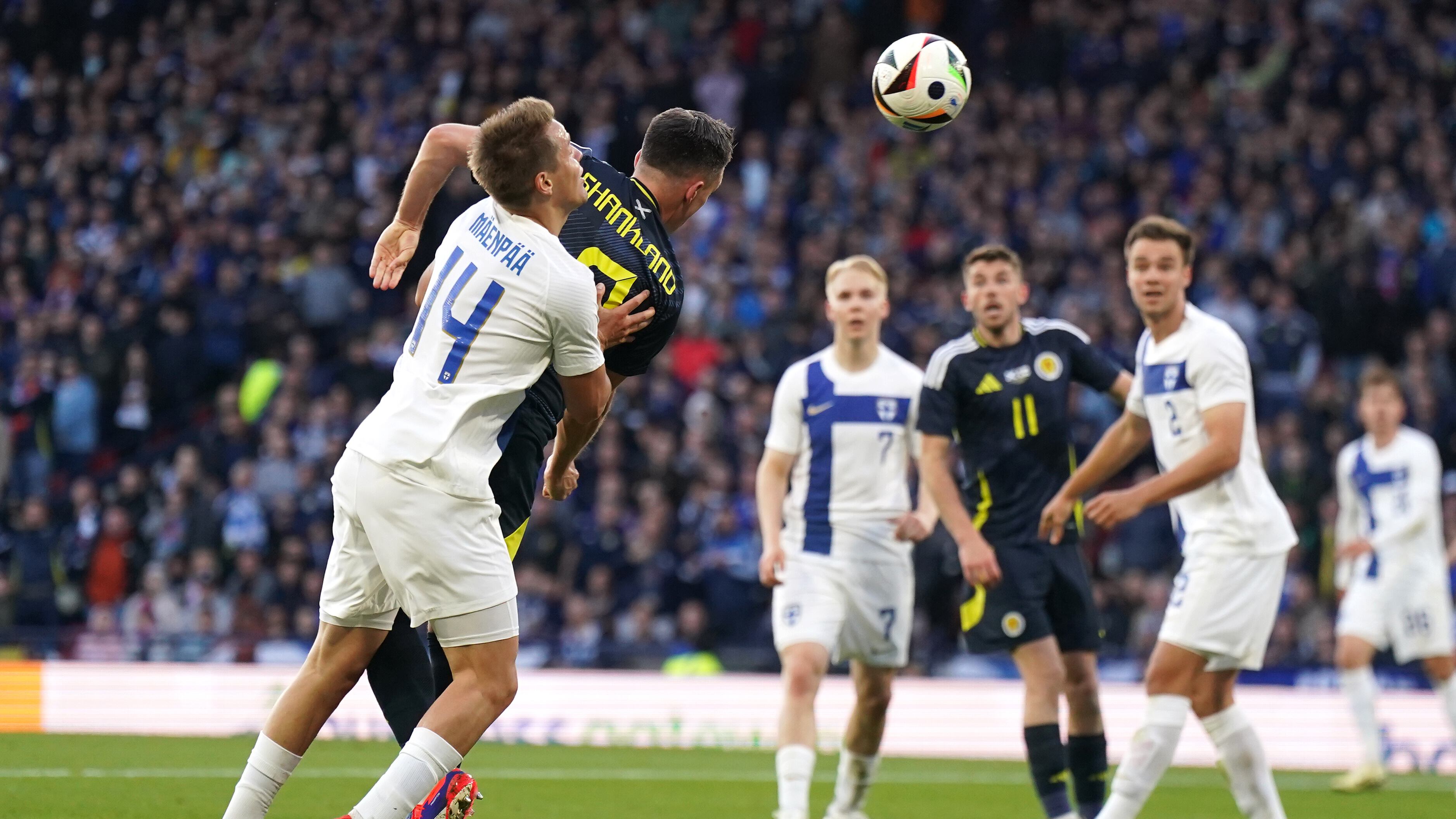 Scotland’s Lawrence Shankland, second left, scores their second goal against Finland